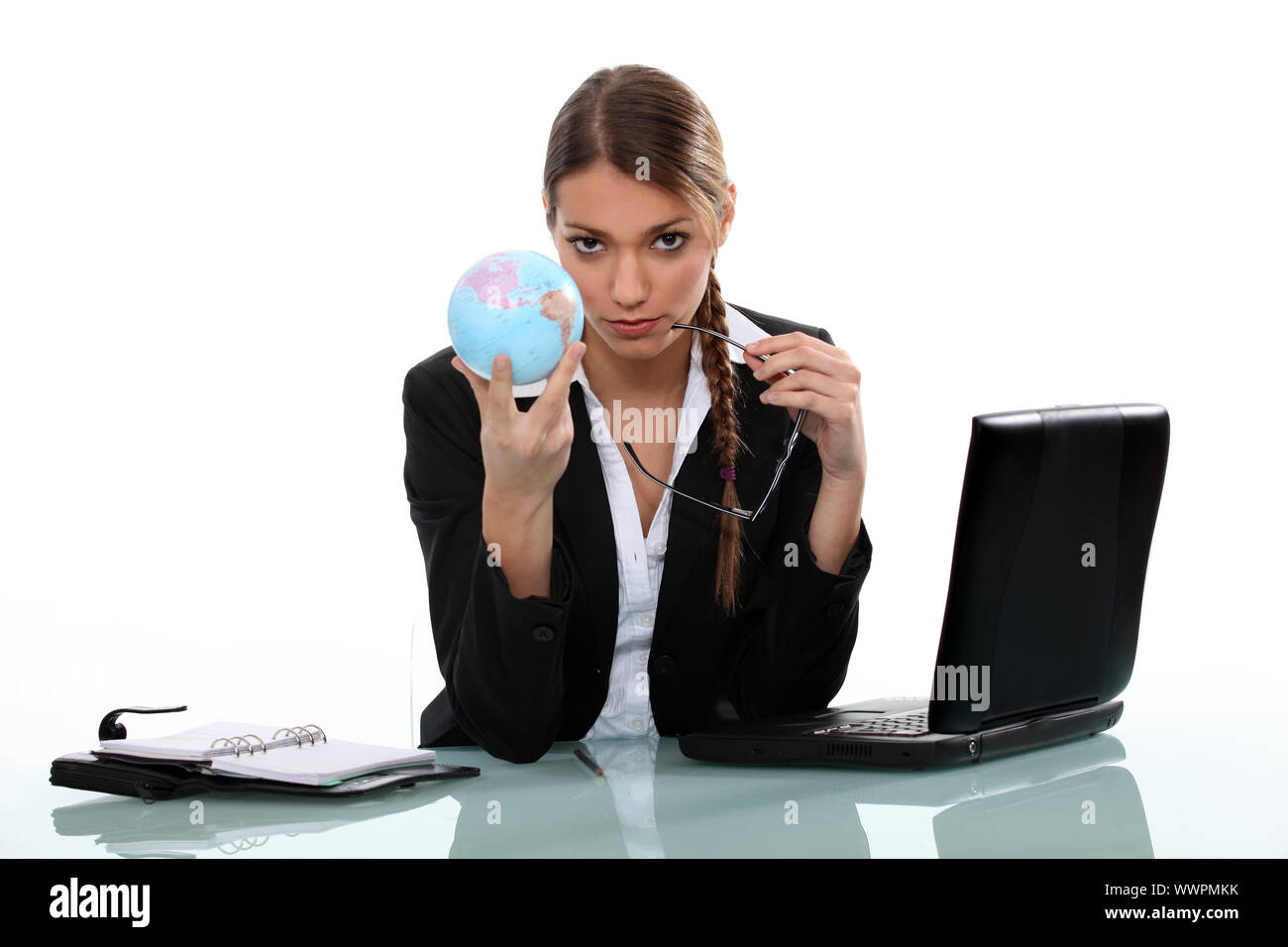 Office worker holding globe Stock Photo