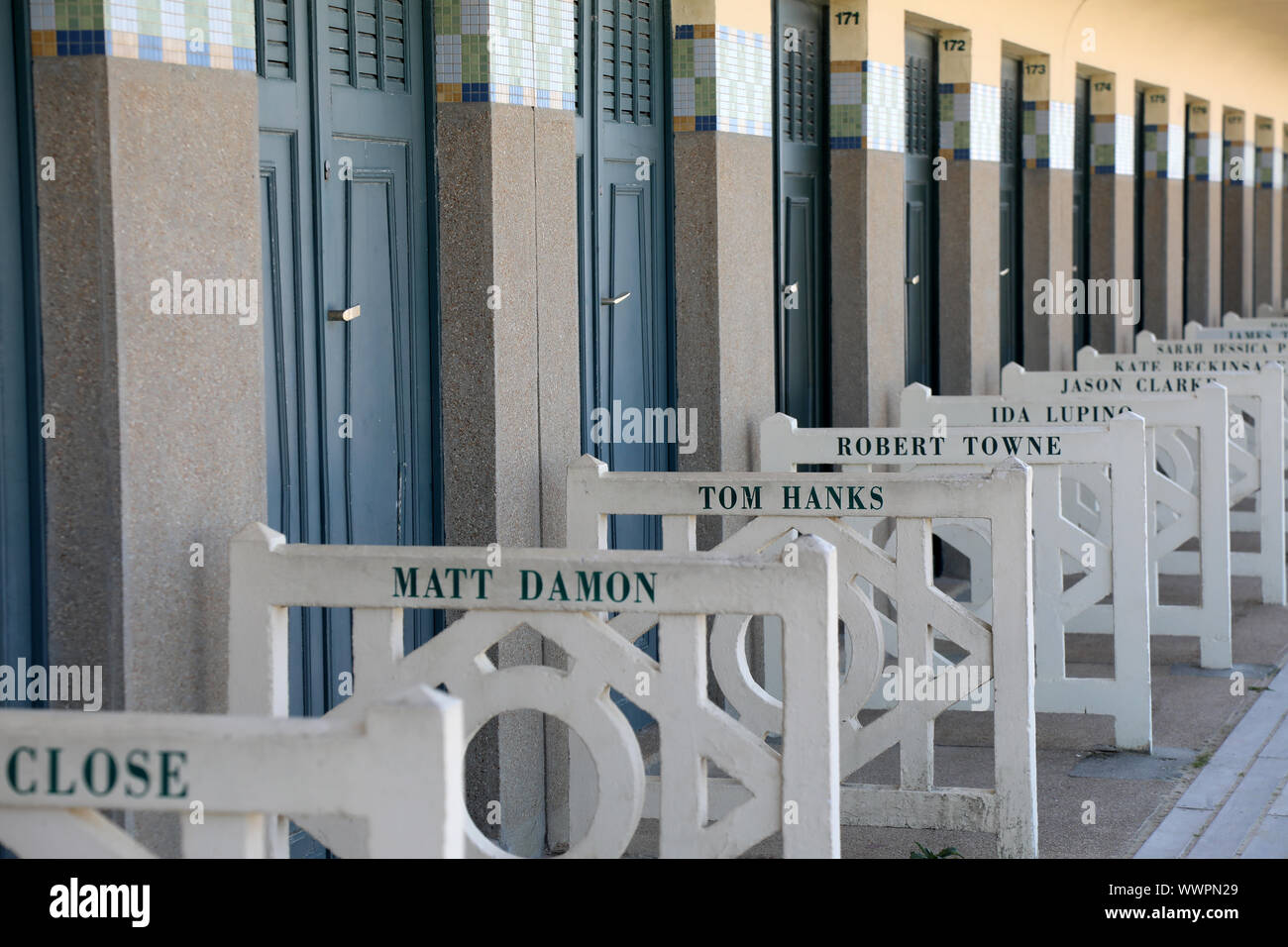 Deauville / France – September 14, 2019: The Promenade des Planches, where names of famous actors and directors that have visited the town are painted Stock Photo