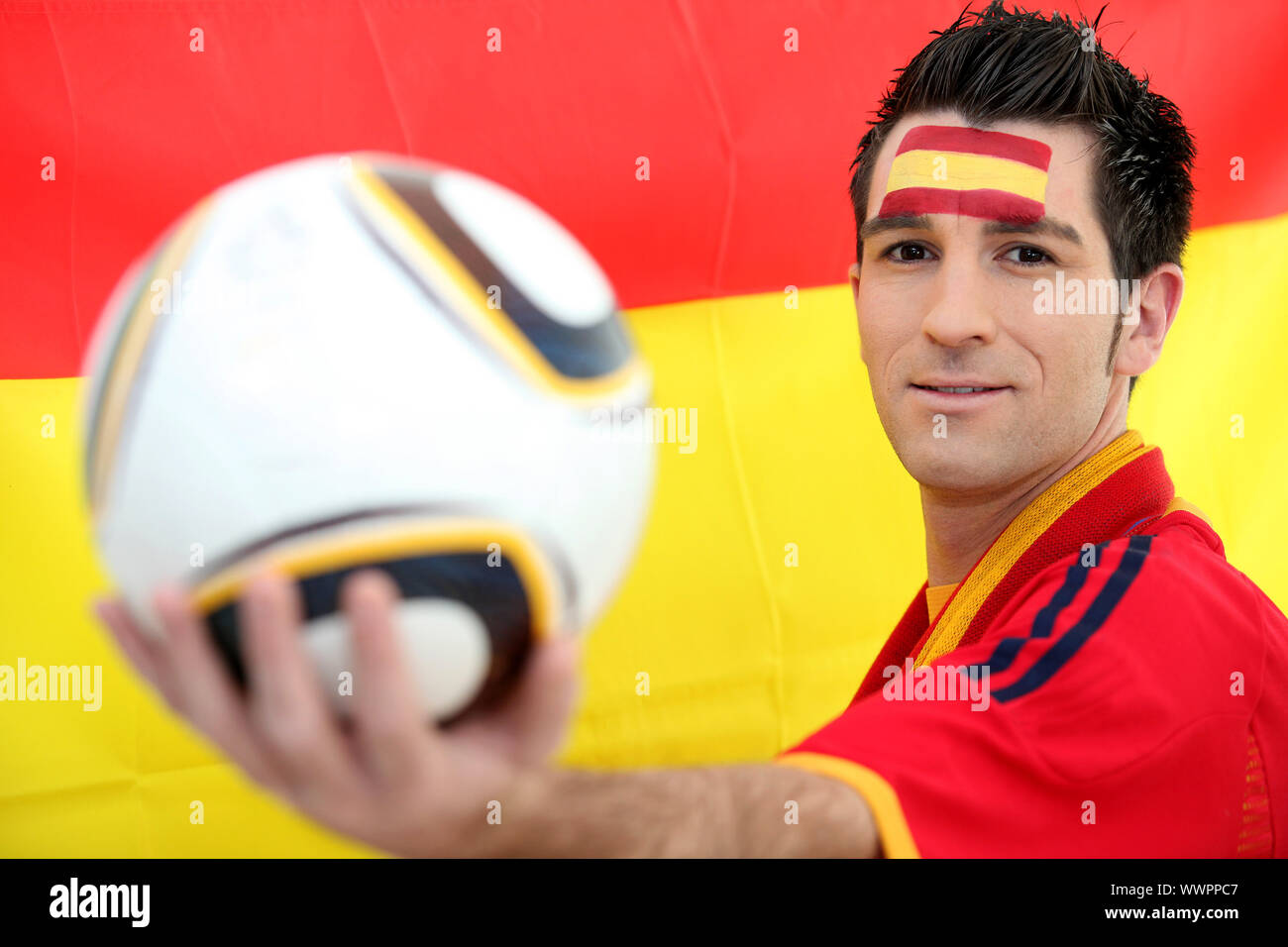 Male Spanish soccer supporter holding ball Stock Photo Alamy