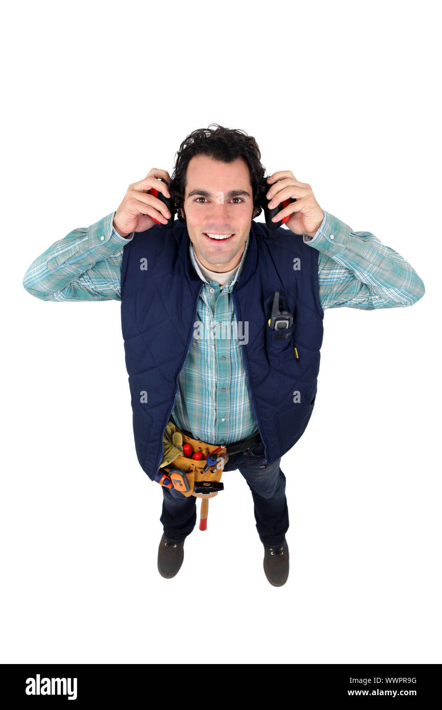 Worker wearing ear defenders Stock Photo Alamy