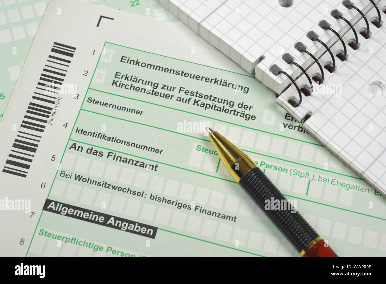Income tax return and form with pen Stock Photo