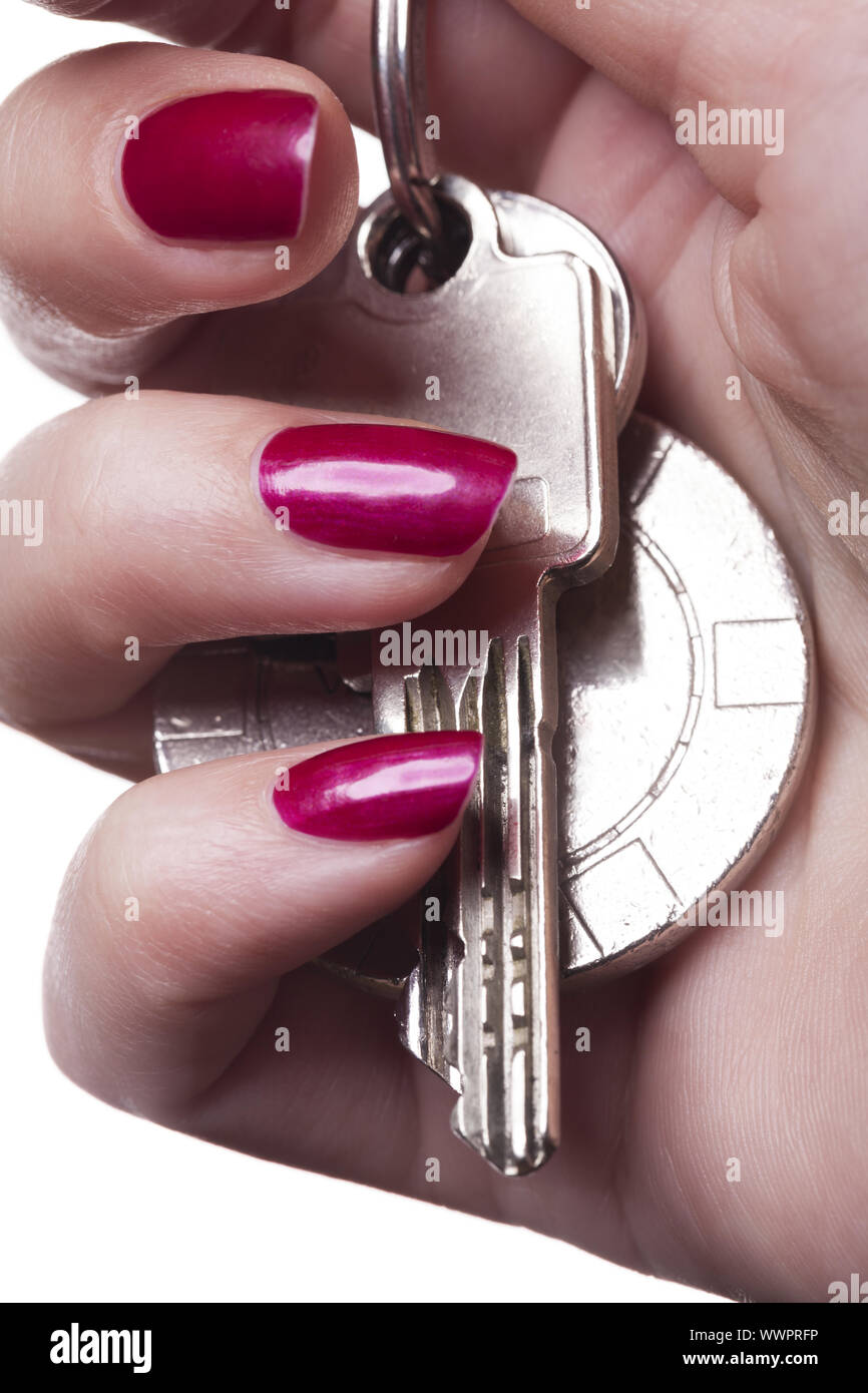 red lacquered fingernails with key ring insulated Stock Photo