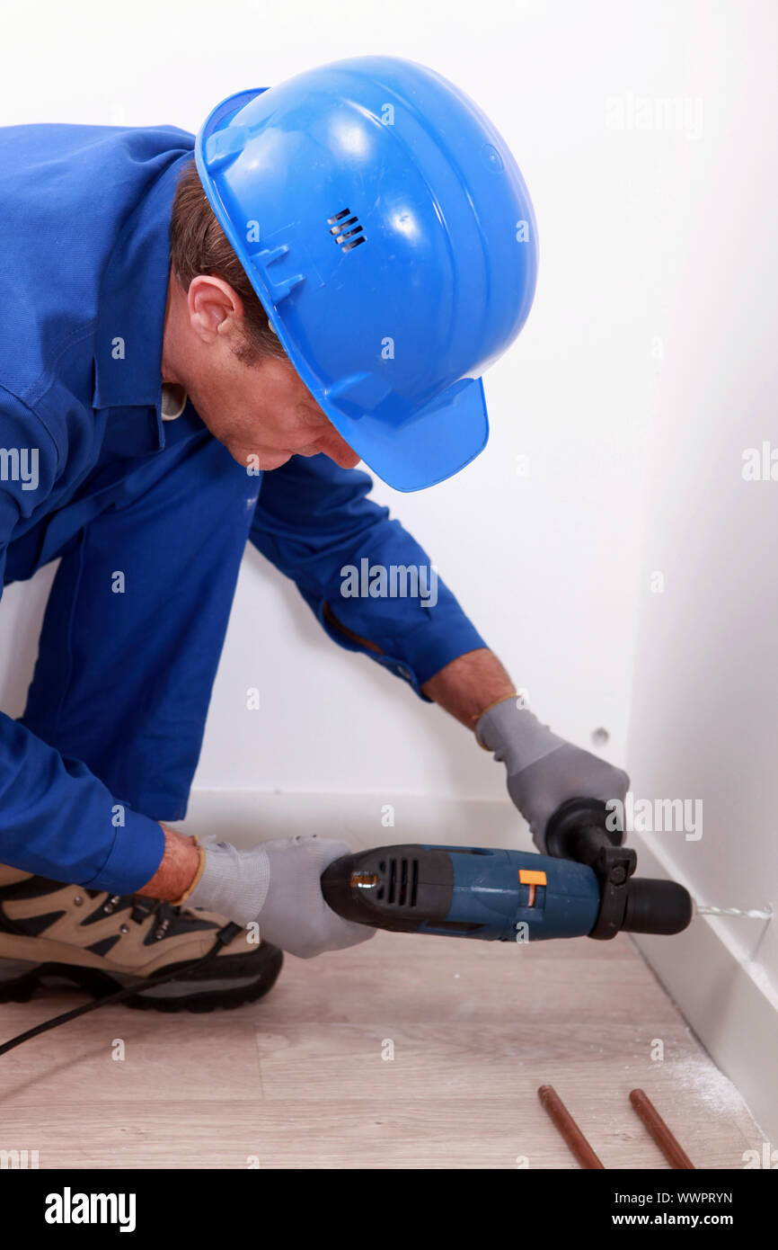 worker drilling Stock Photo