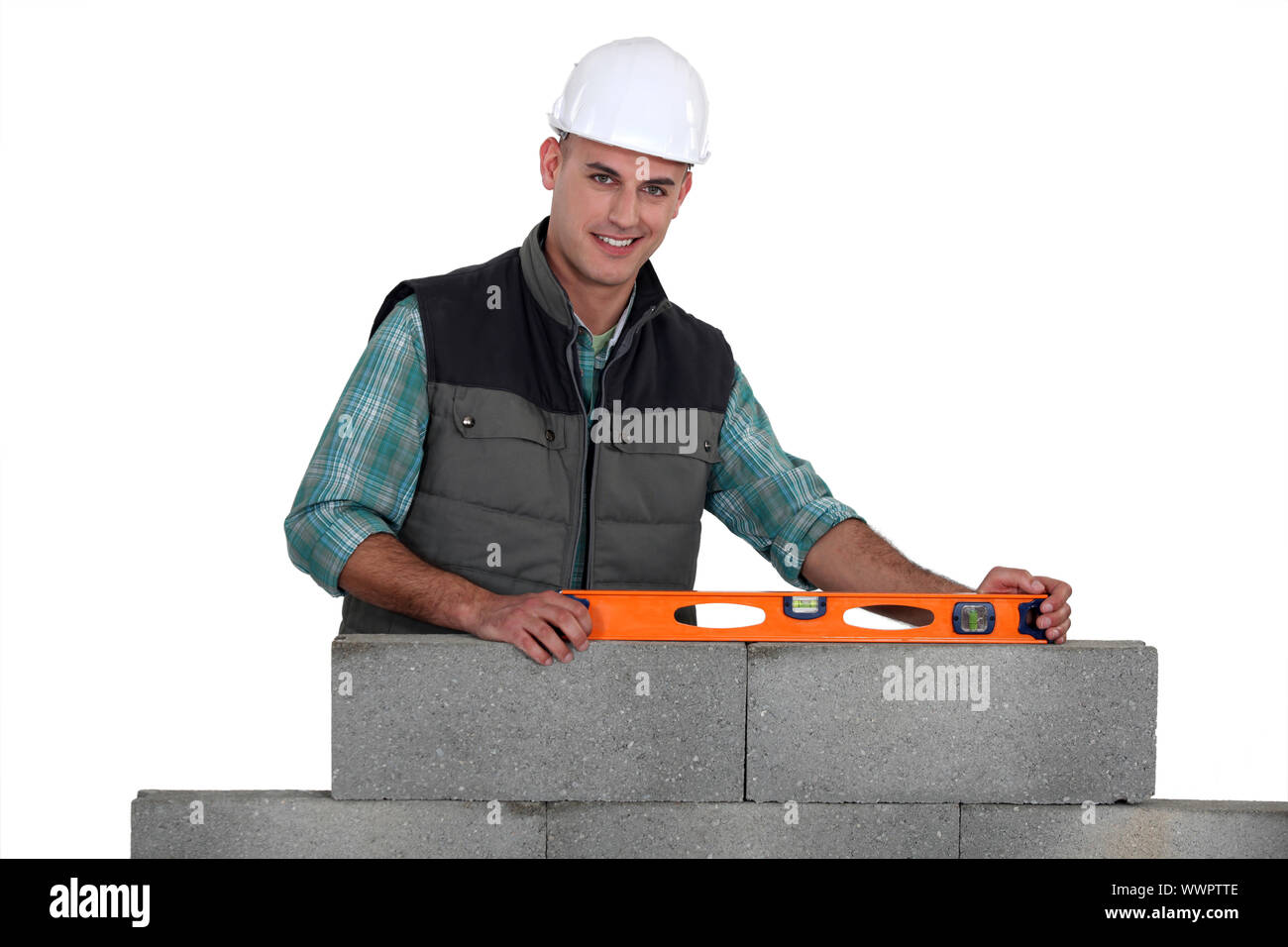 Construction worker using a bubble level Stock Photo