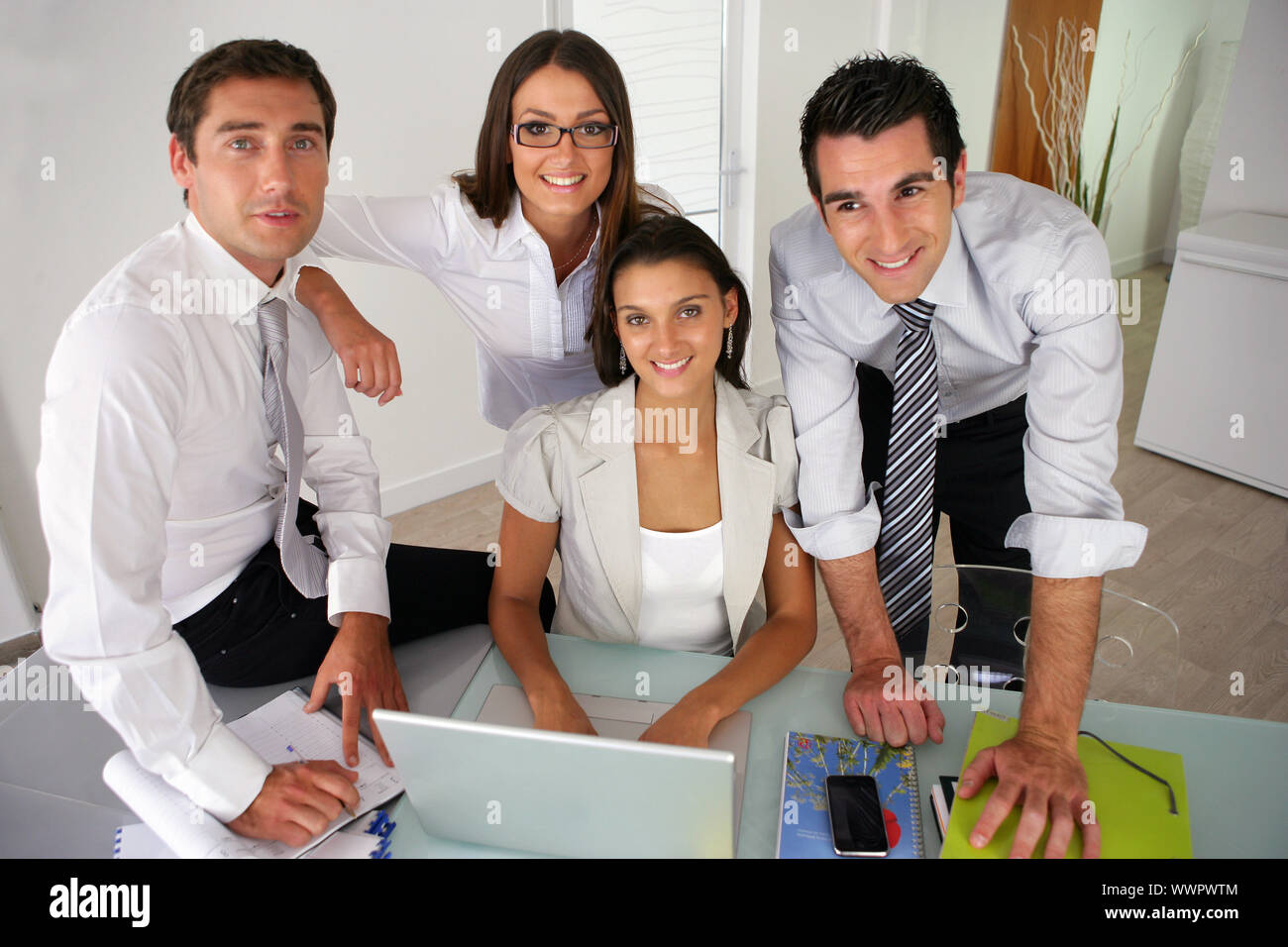 Business team posing together Stock Photo - Alamy