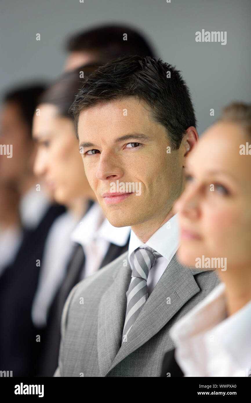 Businesspeople stood in a row Stock Photo