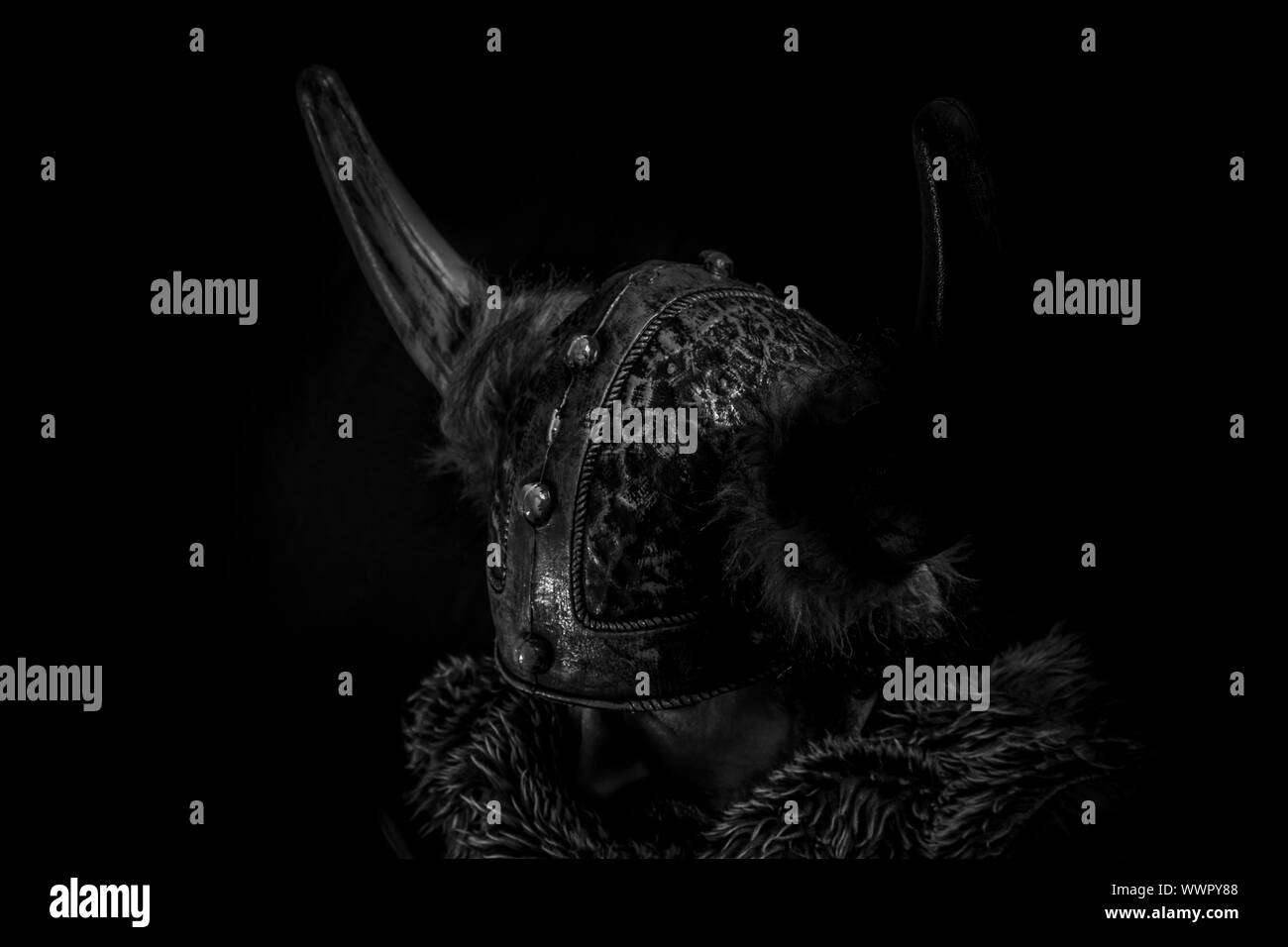 Costume, Viking warrior with a huge sword and helmet with horns Stock Photo Alamy