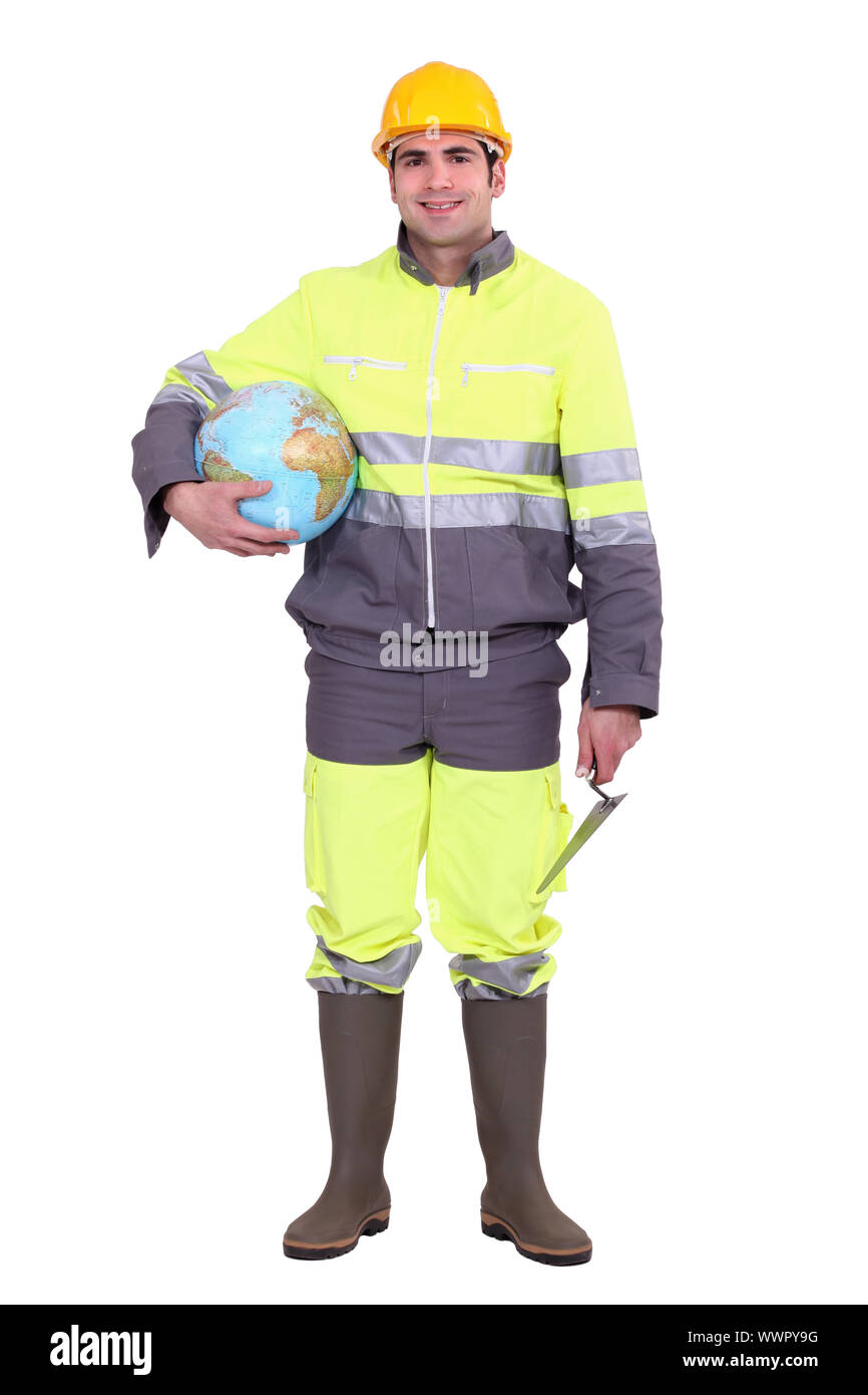 Worker carrying globe under arm Stock Photo