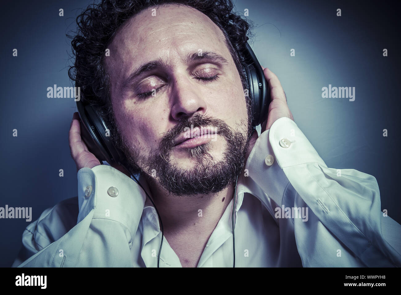 classical music, man with intense expression, white shirt Stock Photo