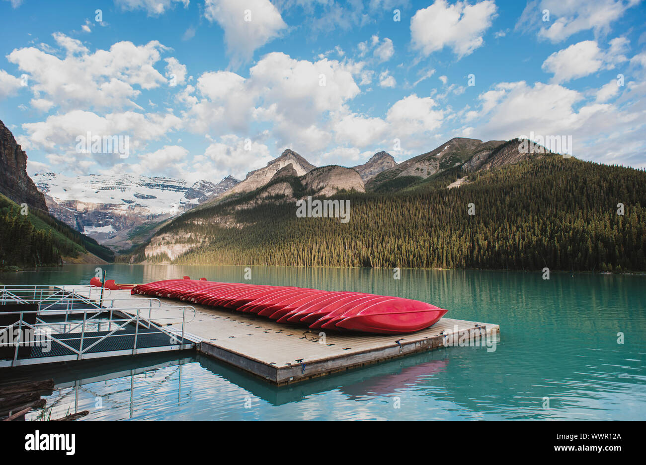 Banff Dock Red canoes on dock of Lake Louise in Banff, Alberta, Canada Stock Photo ...