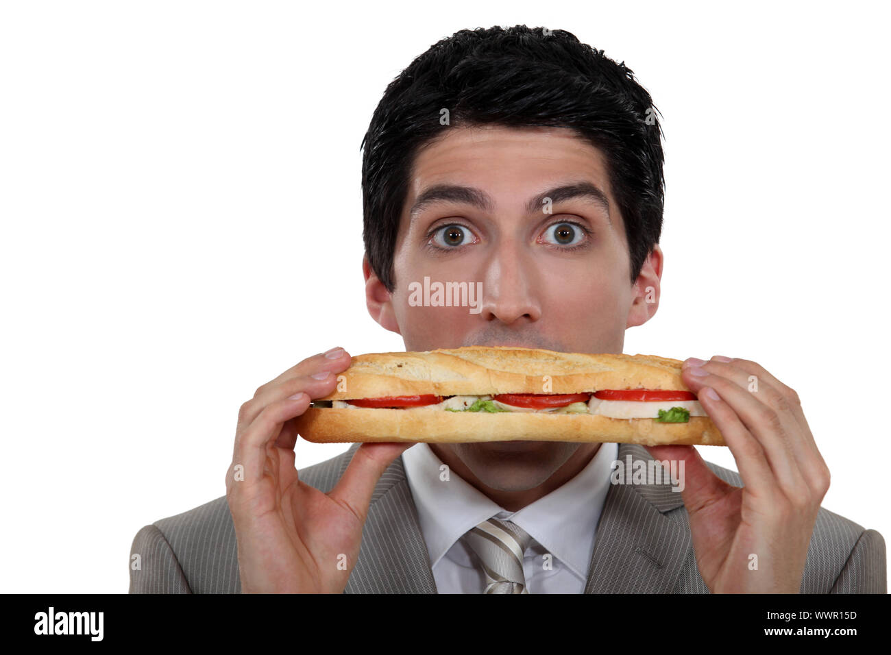 A man holding a sandwich Stock Photo - Alamy