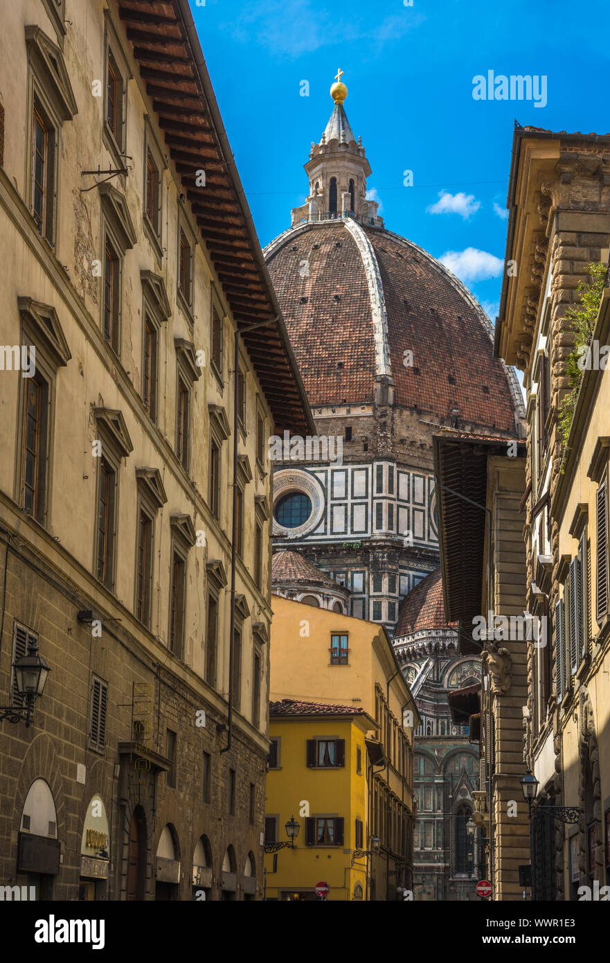 Street of Florence with Santa Maria del Fiore Cathedral, also called Duomo, in the back, Tuscany, Italy Stock Photo