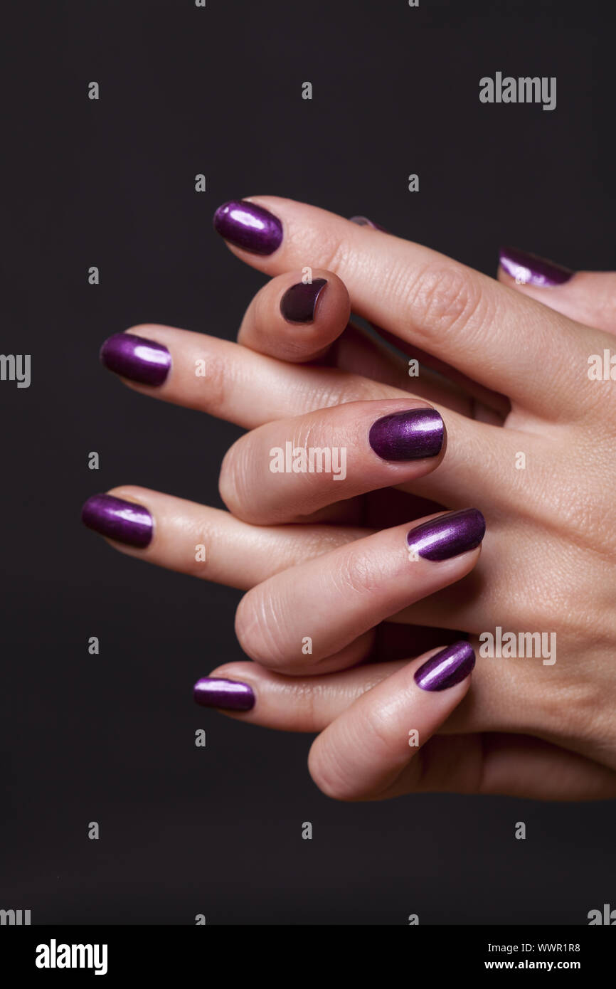 Close up of female hands over black Stock Photo