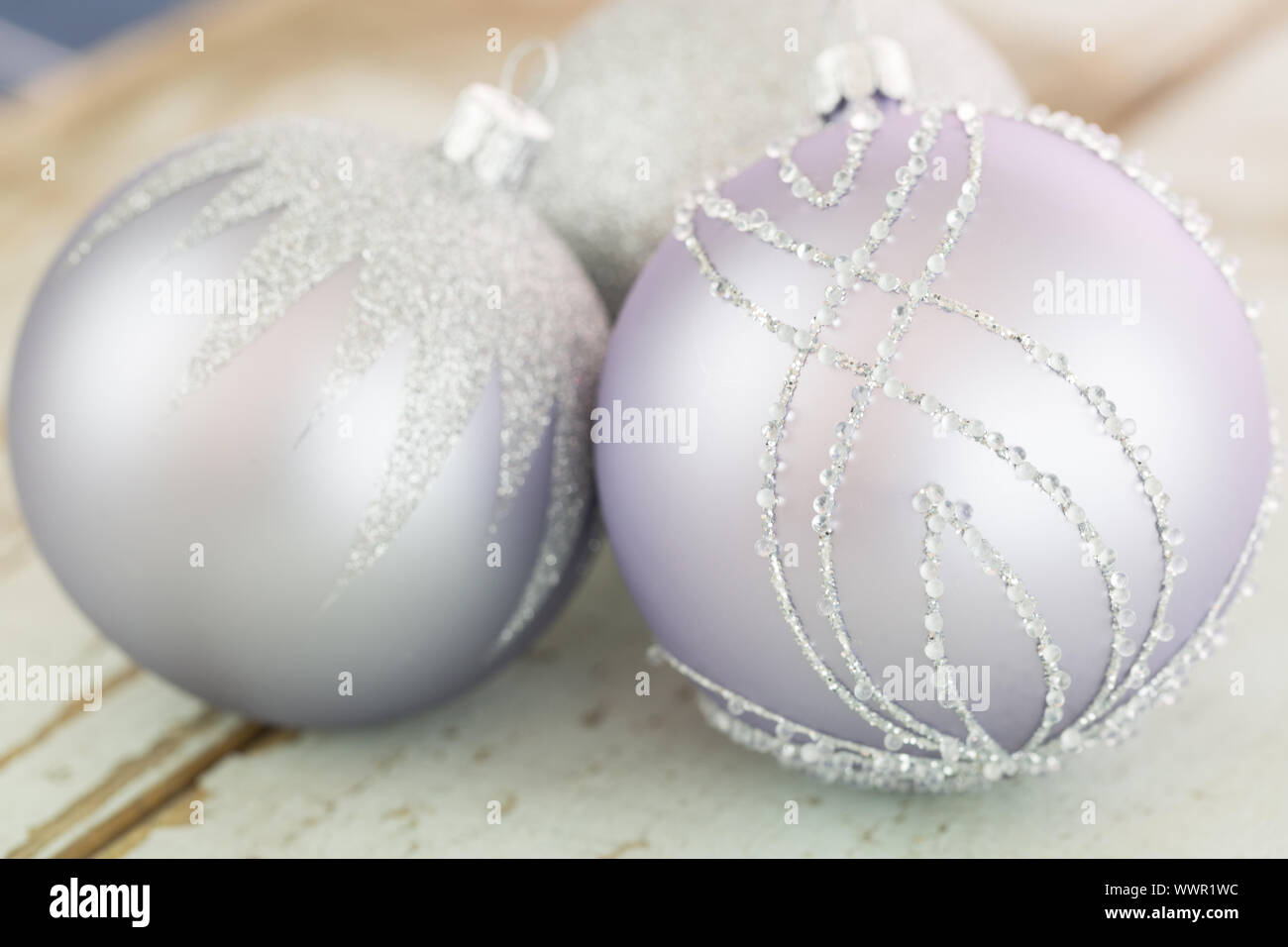 Decorated silver Christmas baubles Stock Photo