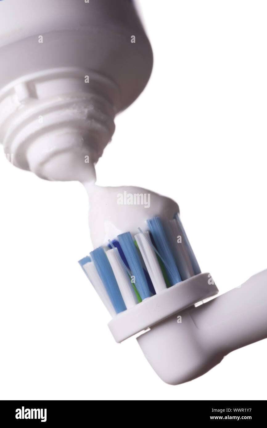 Close up of electric toothbrush and paste on white Stock Photo
