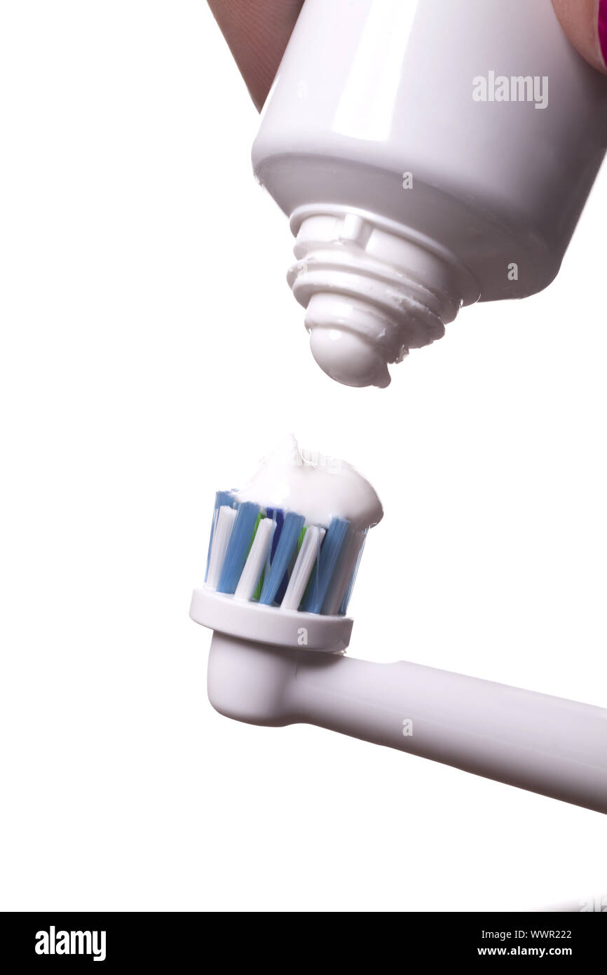 Close up of electric toothbrush and paste on white Stock Photo