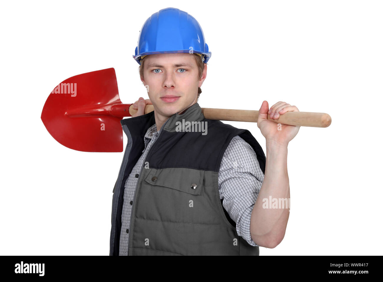 Tradesman holding a spade Stock Photo