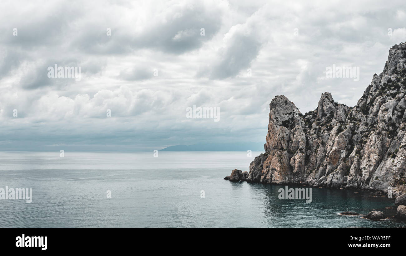 Sea, mountains, clouds Stock Photo