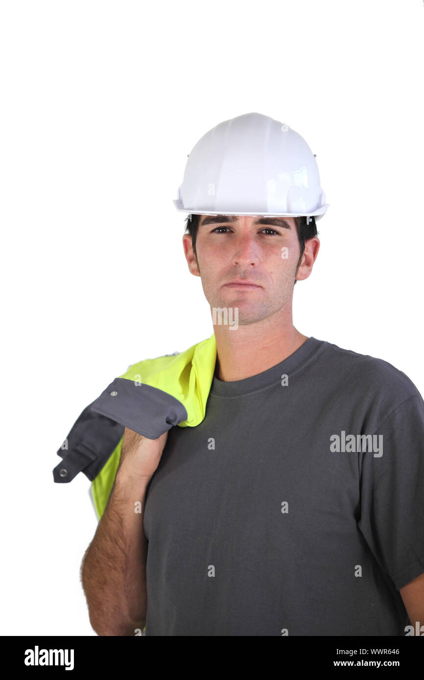 Man carrying reflective jacket over shoulder Stock Photo