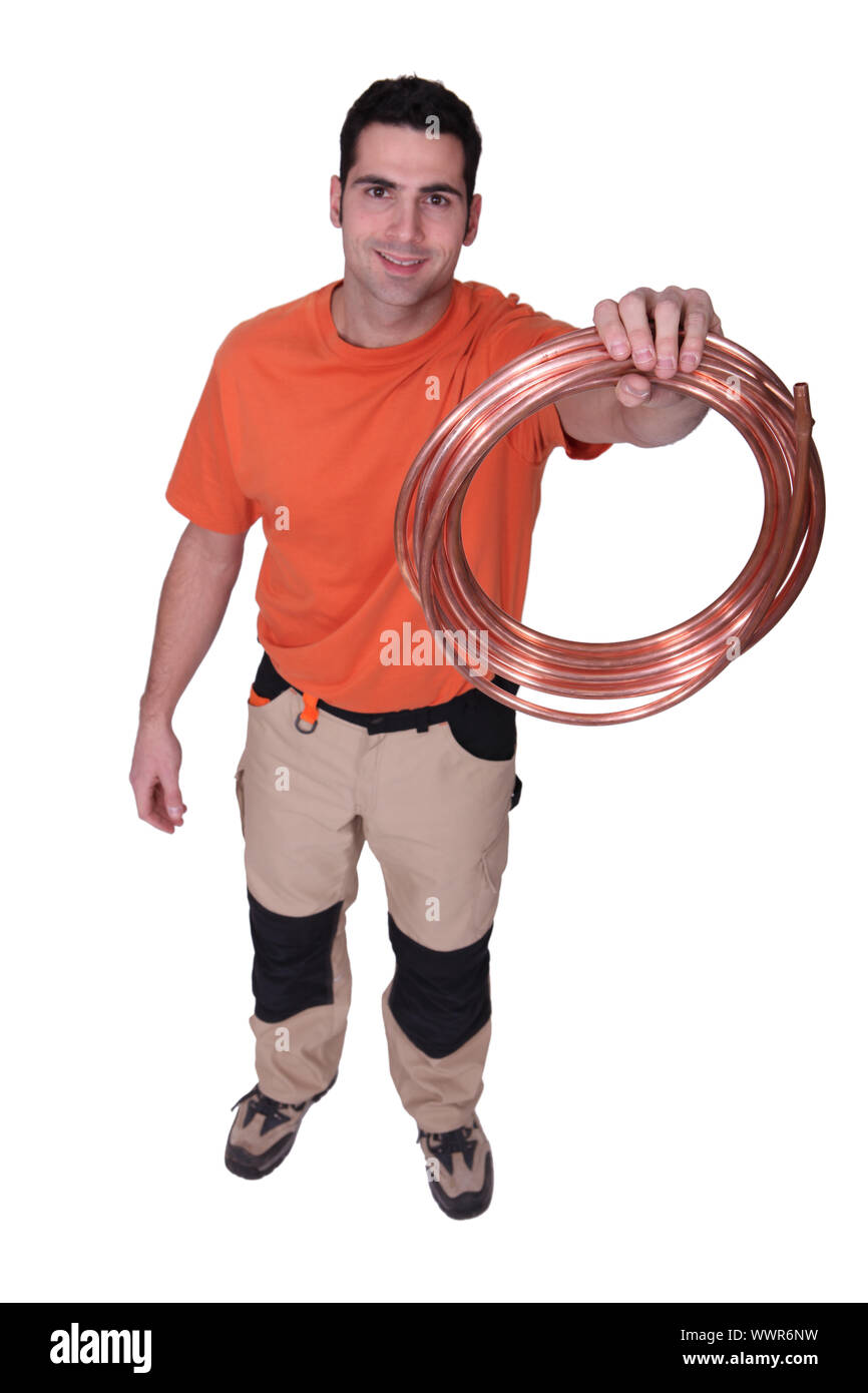 Laborer Holding Copper Pipe Stock Photo Alamy