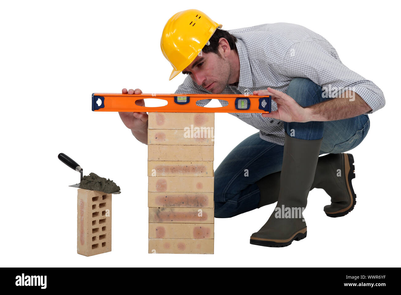 Tradesman using a spirit level Stock Photo