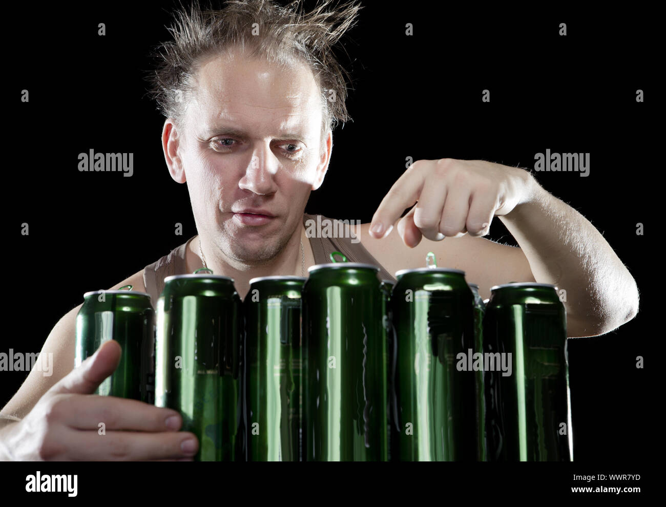 Hangover.The drunk man and is a lot of empty beer cans Stock Photo Alamy