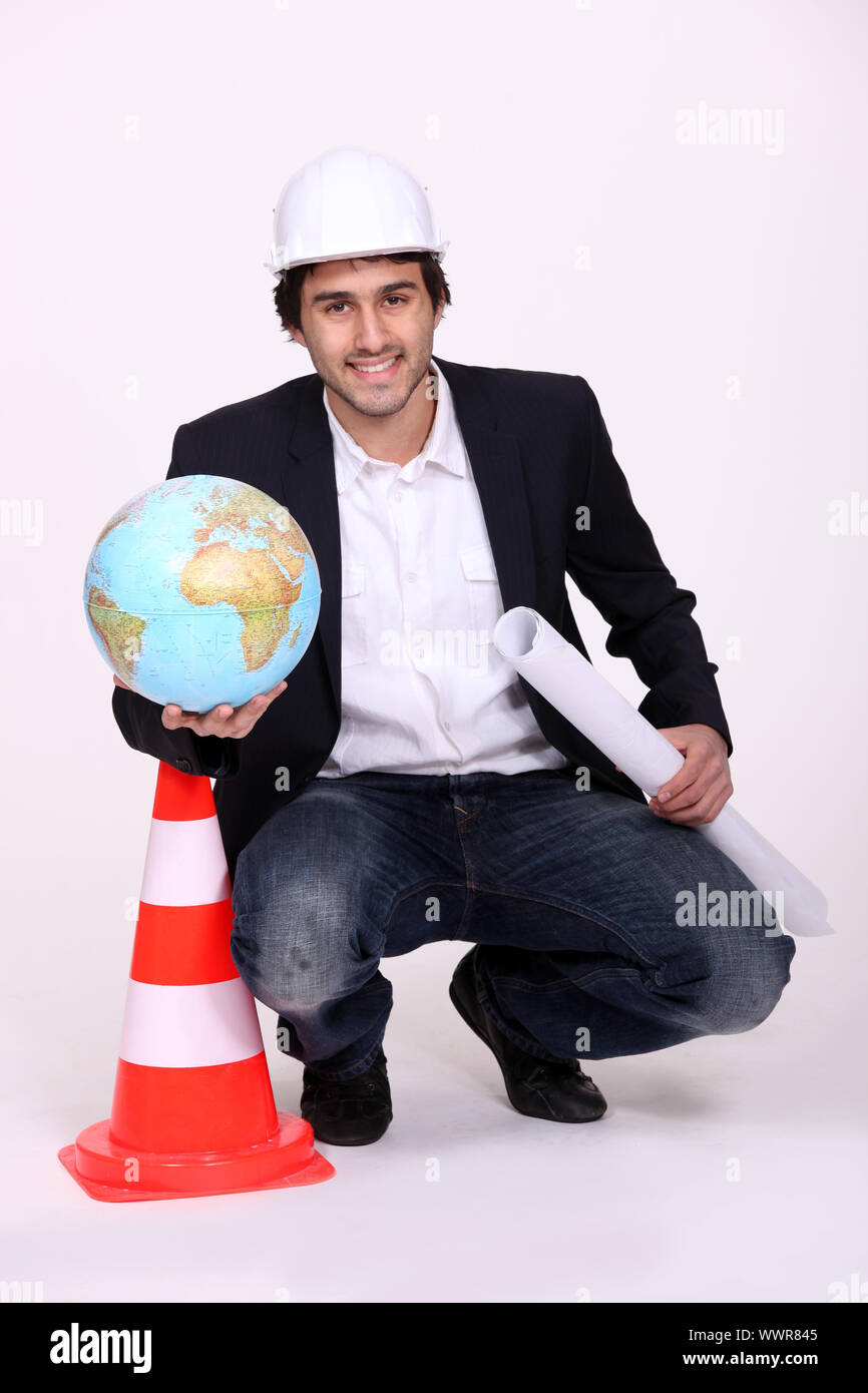 Architect holding a globe Stock Photo