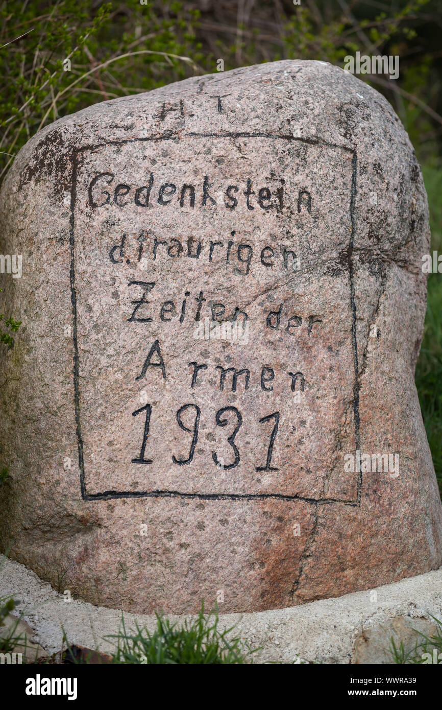 Memorial stone to the sad times of the poor 1931 Stock Photo