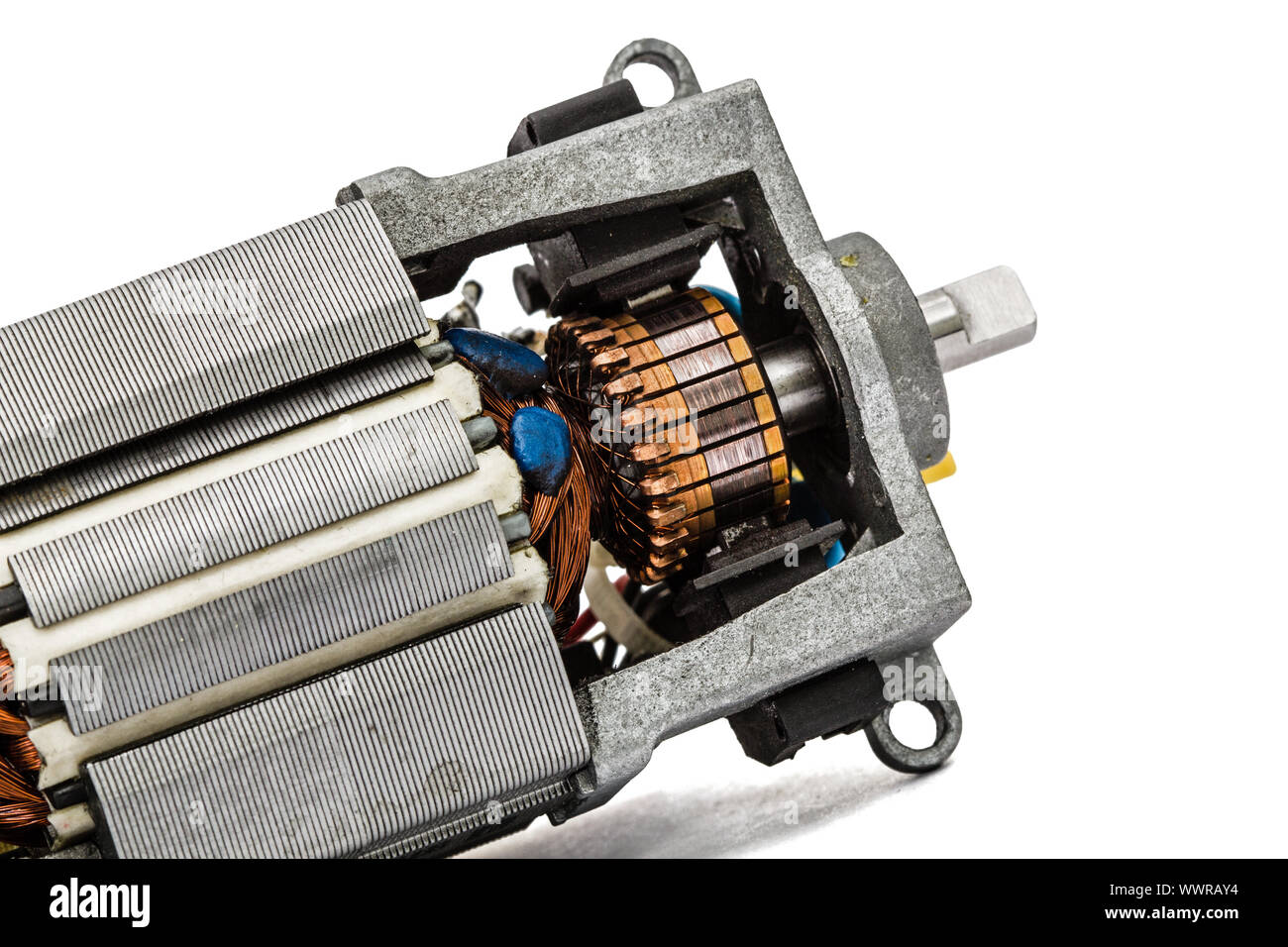 Part of small electric motor, closeup, isolated on white background