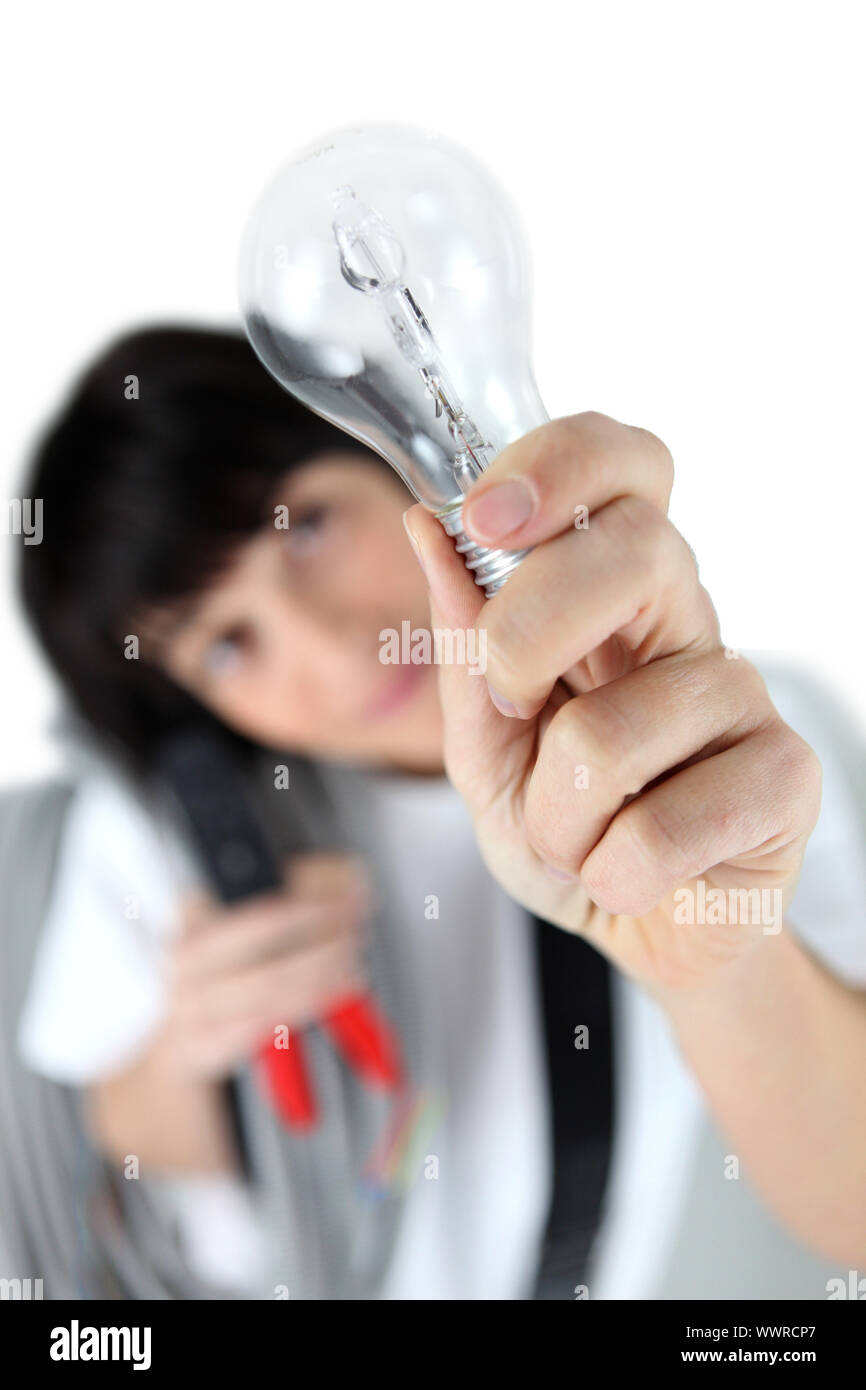 craftswoman holding a bulb Stock Photo