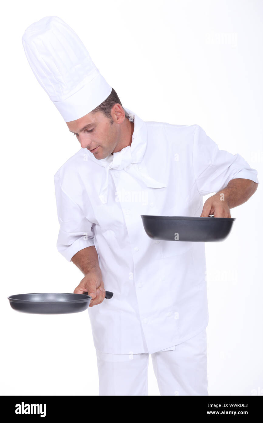 Chef holding two saucepans Stock Photo Alamy