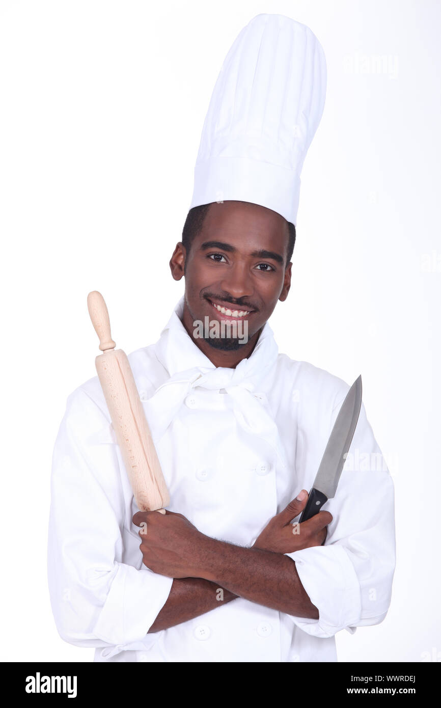 Chef holding knife and rolling pin Stock Photo Alamy