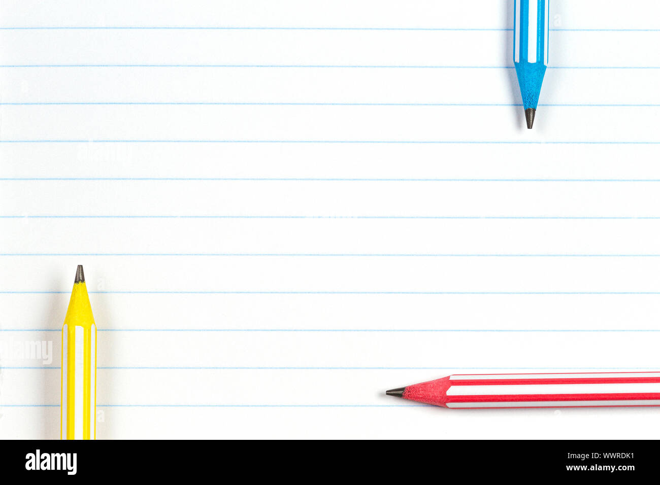 Colorful Striped Pencils On Notebook Lined Paper Background With Copy Space Back To School Education Learning Concept Stock Photo Alamy