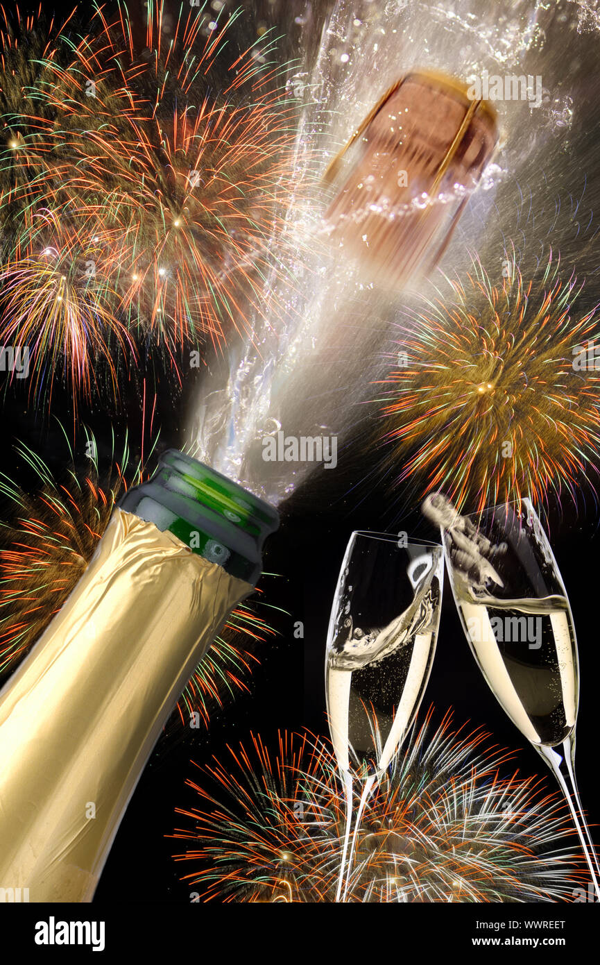 Champagne with flying cork and fireworks Stock Photo
