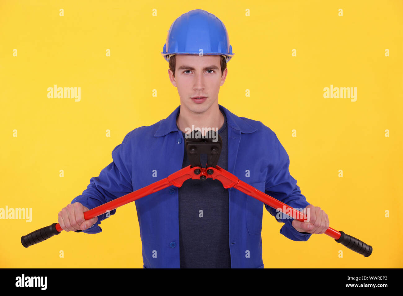 Young worker with bolt cutters Stock Photo Alamy