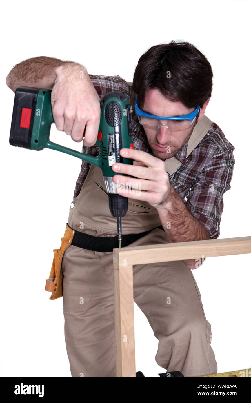 Man using an electric screwdriver Stock Photo