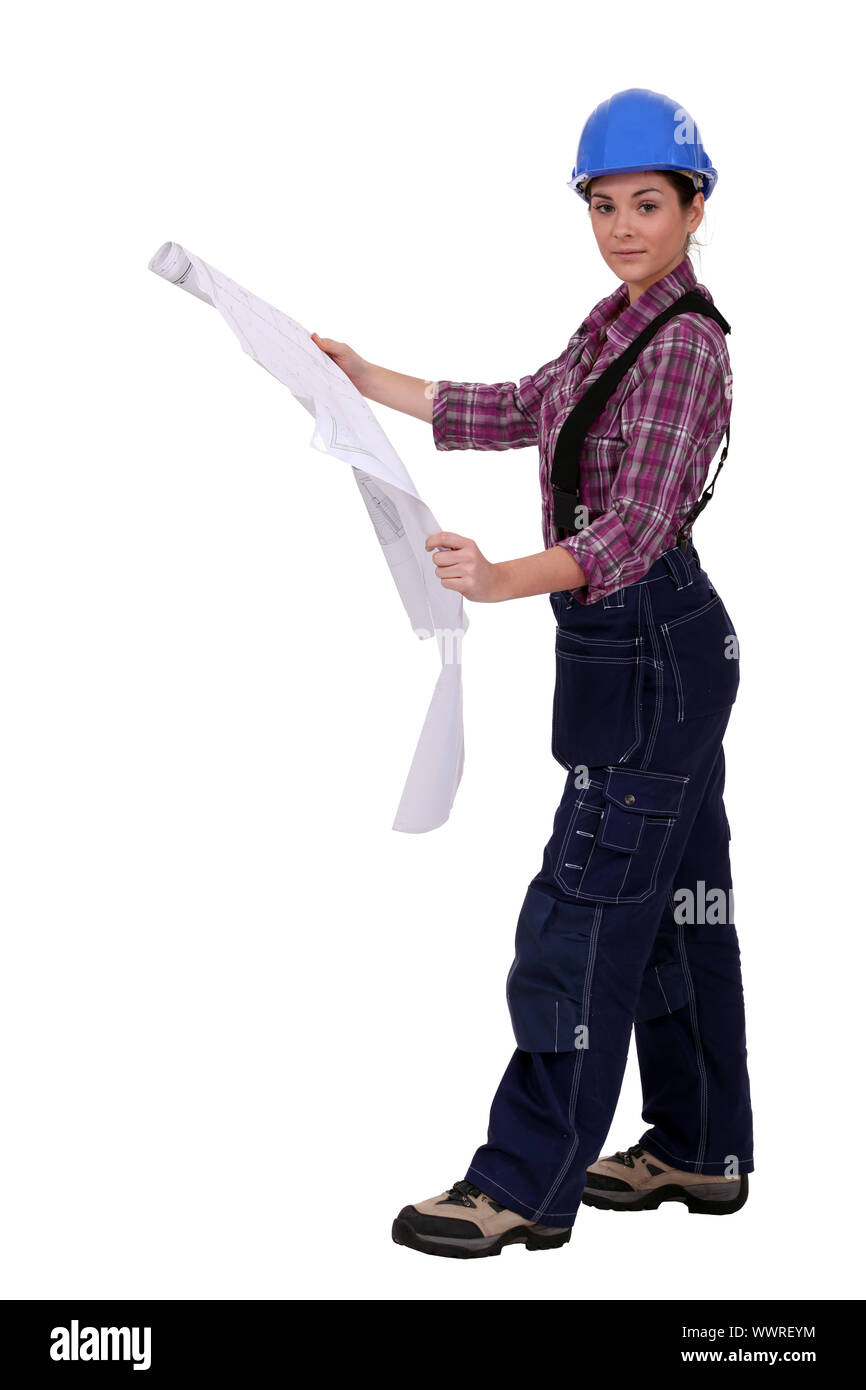 Female builder looking at plans Stock Photo