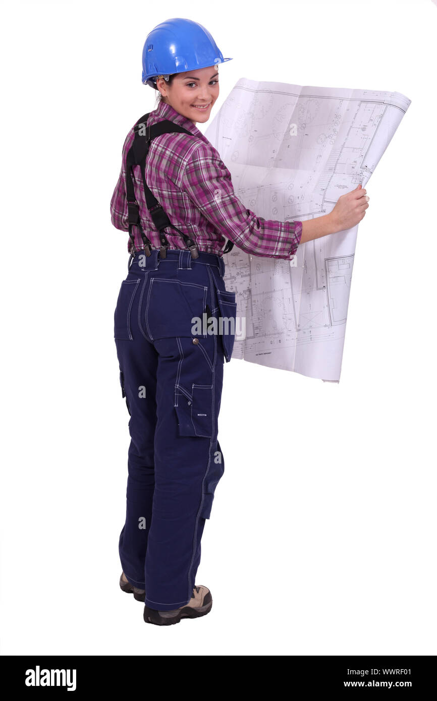 female construction worker watching a blueprint Stock Photo