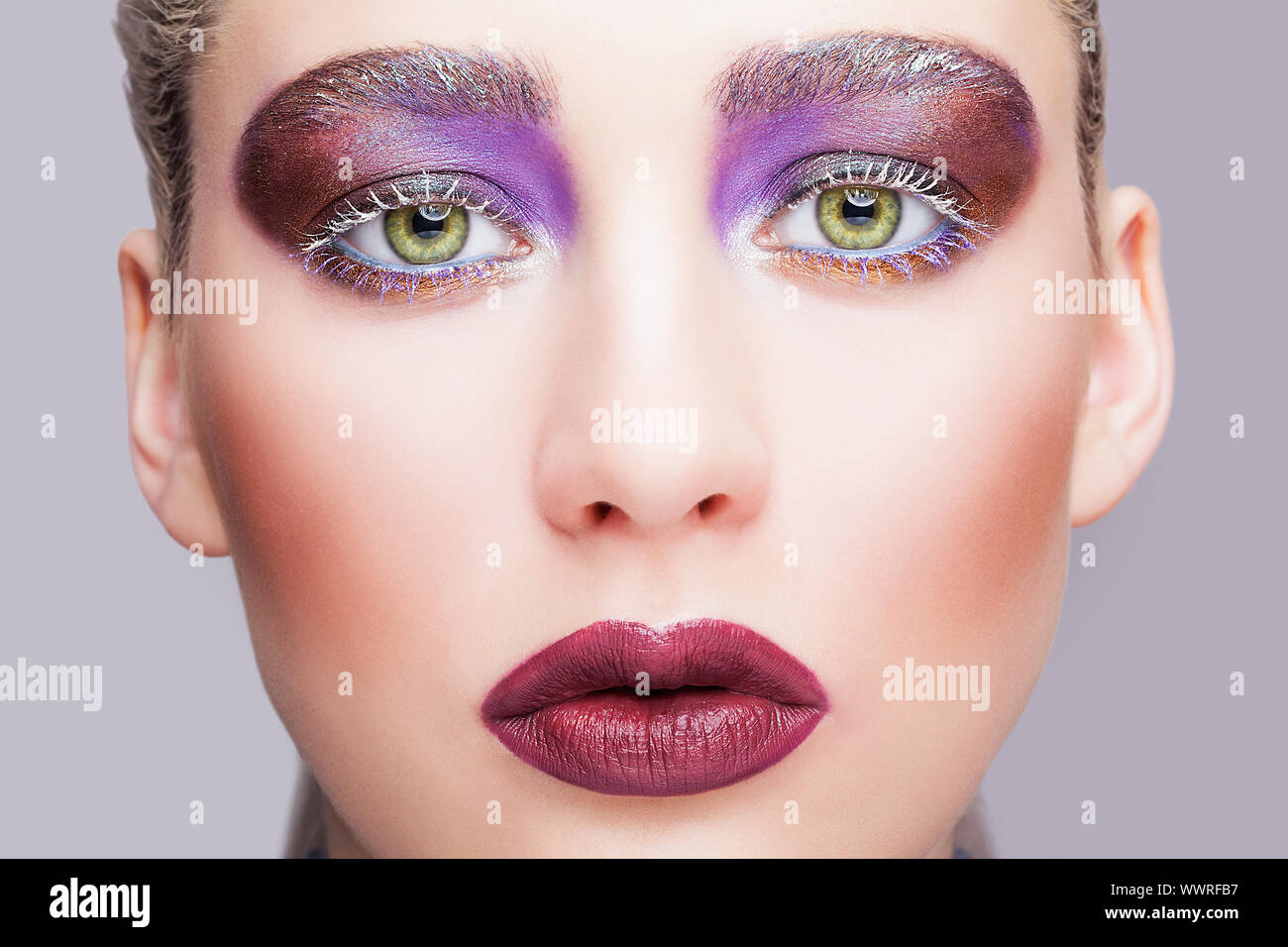 Female green pistachio colour eye with evening violet eyes shadows