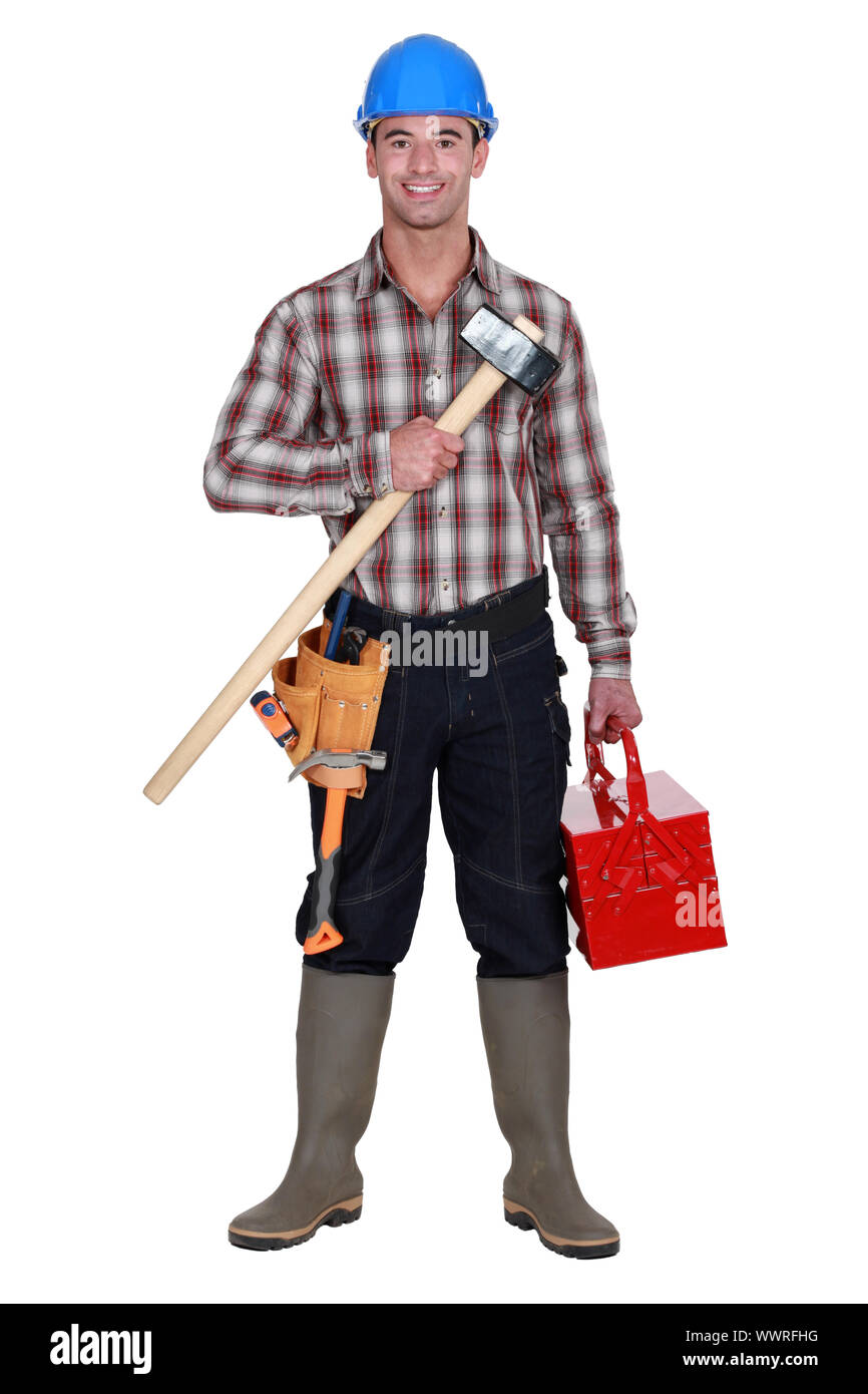 Labourer carrying toolbox Stock Photo Alamy