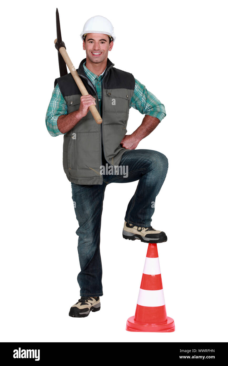 Man holding a pickaxe Stock Photo