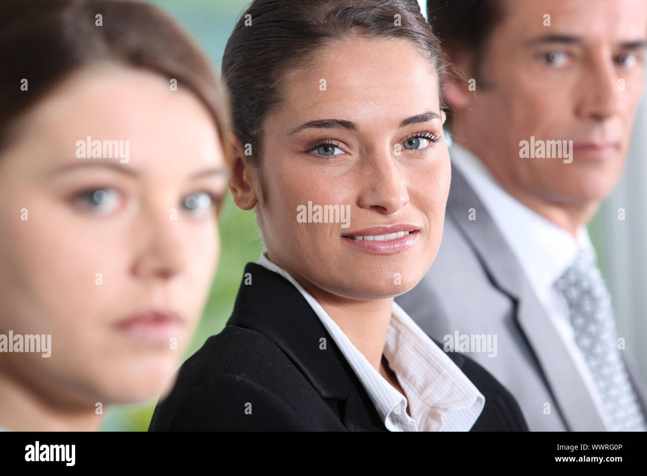 Head shot of three dynamic businesspeople Stock Photo