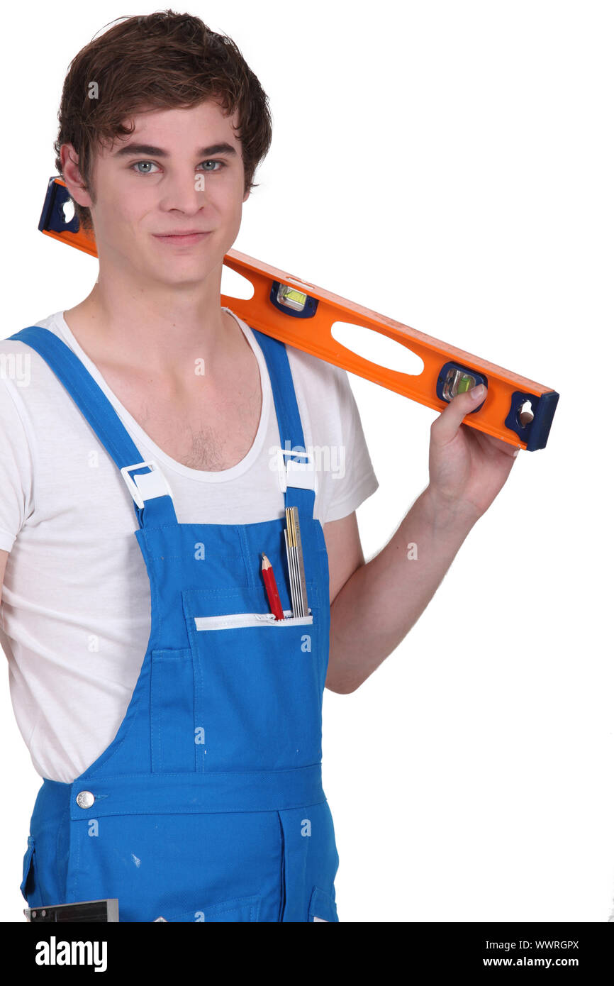 Young man with a spirit level Stock Photo