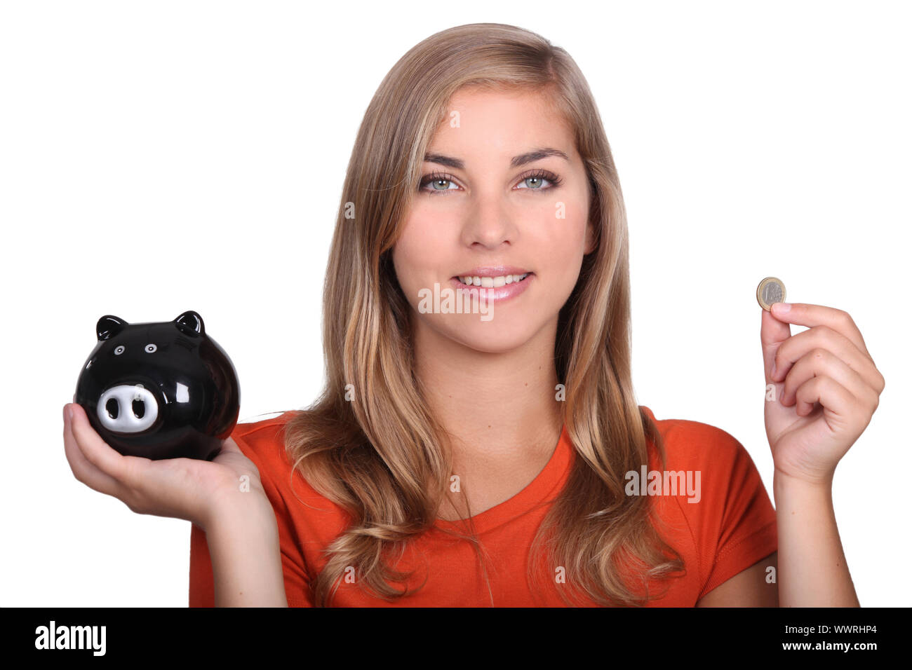 Teenage girl holding piggy bank Stock Photo - Alamy