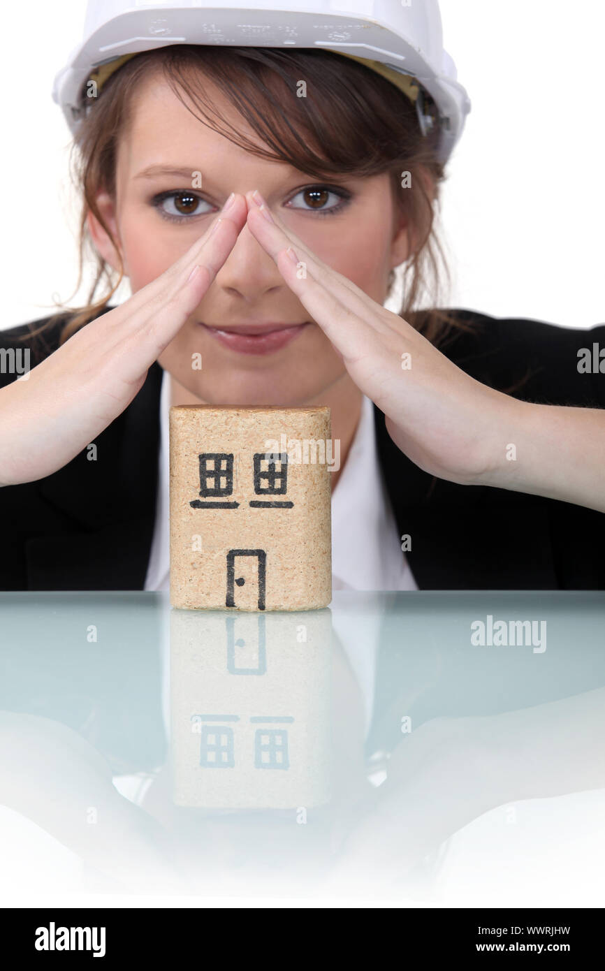 Woman making a roof shape with hands Stock Photo