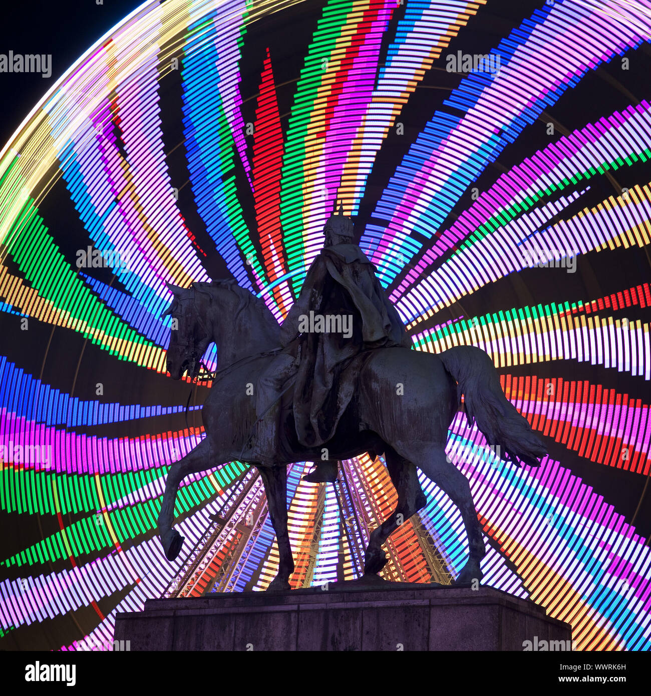 equestrian statue of Emperor Wilhelm I in front of colourfull ferris wheel, Essen, Germany, Europe Stock Photo