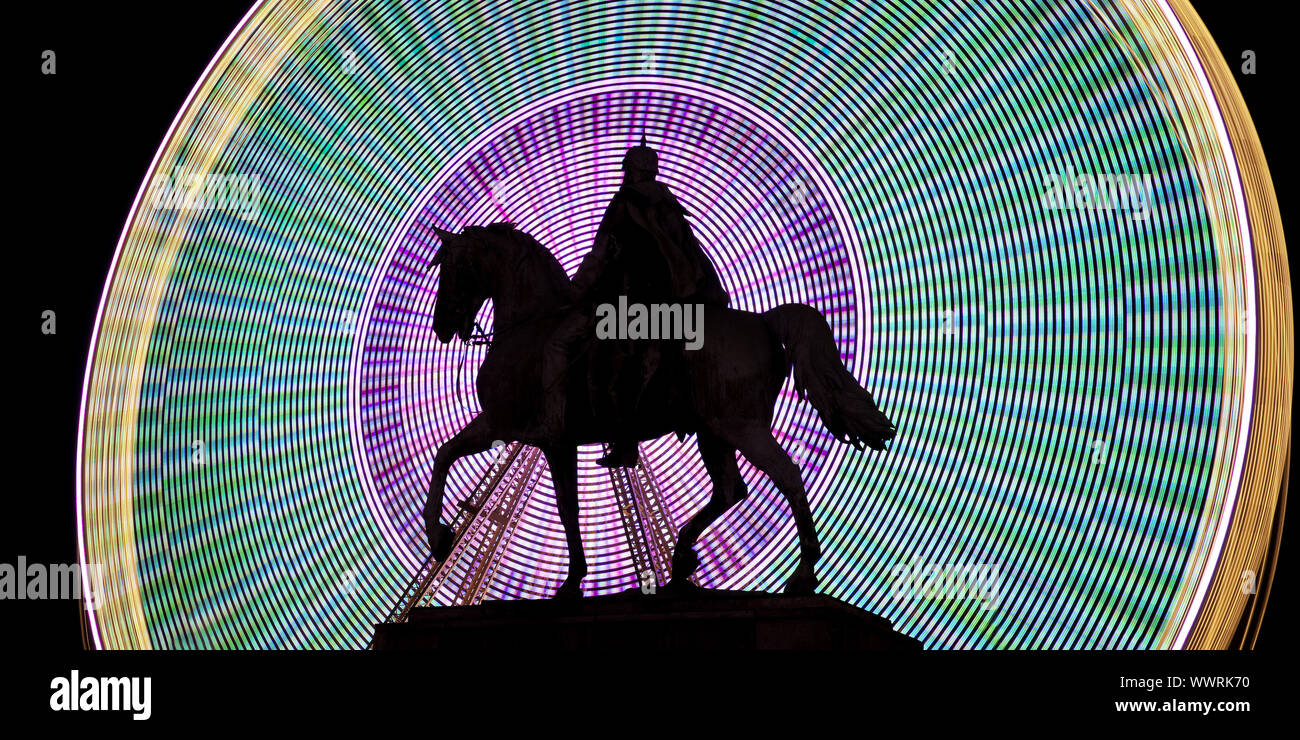 equestrian statue of Emperor Wilhelm I in front of colourfull ferris wheel, Essen, Germany, Europe Stock Photo