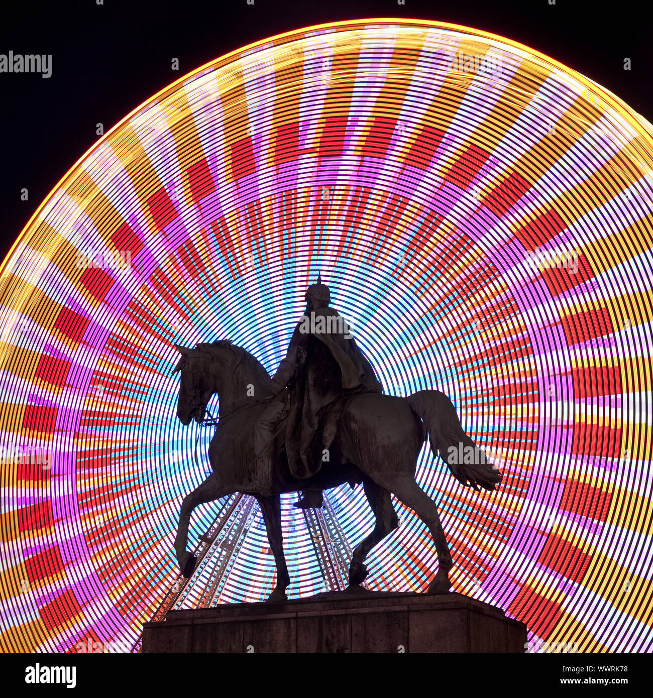 equestrian statue of Emperor Wilhelm I in front of colourfull ferris wheel, Essen, Germany, Europe Stock Photo