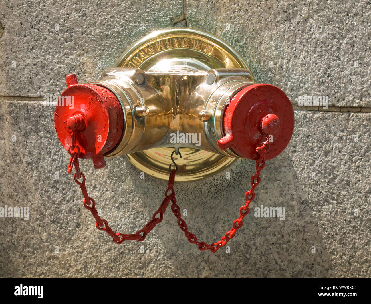 A standpipe on a New York City wall. Stock Photo