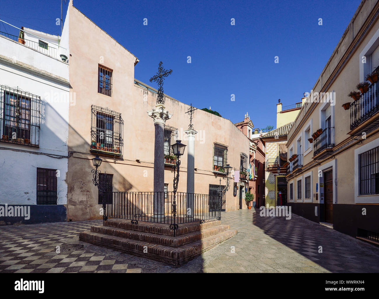 Cross of Locksmith in the famous neighborhood of Holy Cross, also known as Barrio de Santa Cruz, Seville, Andalusia, Spain, a former Jewish Quarter - Stock Photo